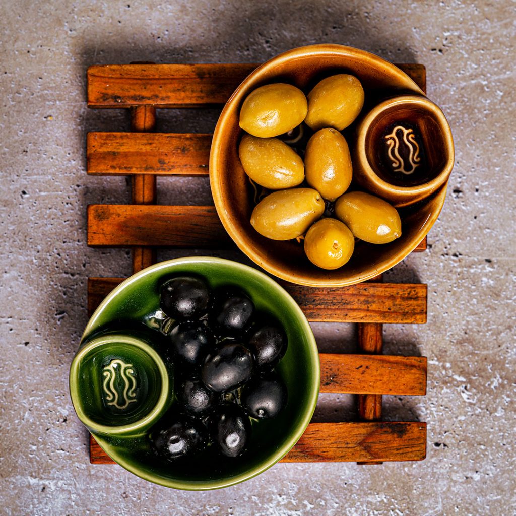 Bowls of green and black olives
